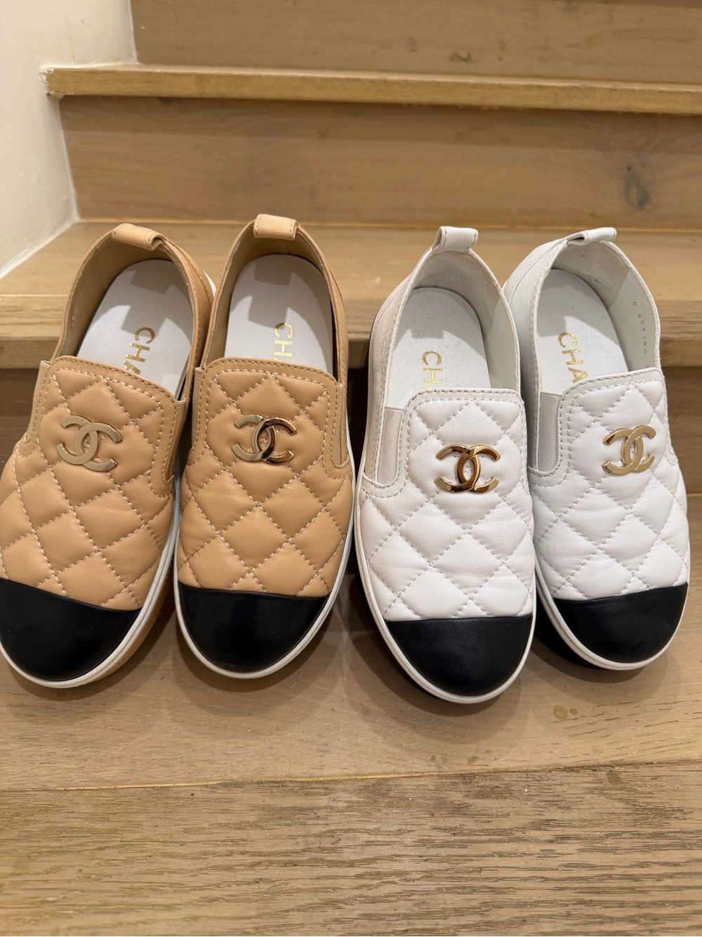 CHANEL Quilted Leather Slip-On Sneakers in Beige & White with Black Cap Toe